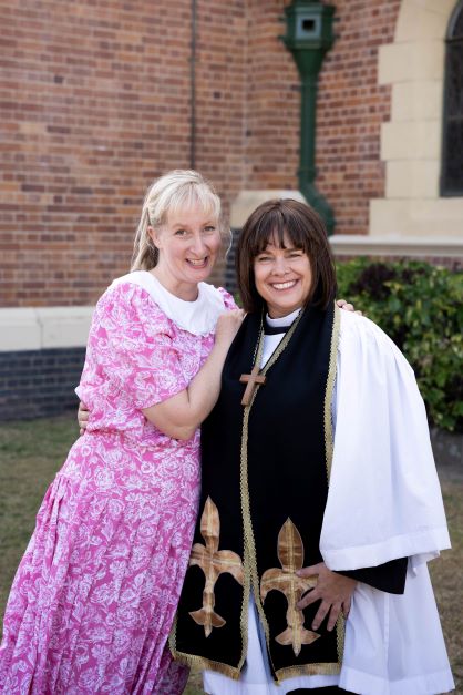 Katrina Knight as Alice Tinker and Tracey Shears as Geraldine Grainger outside the Bundaberg Anglican Church