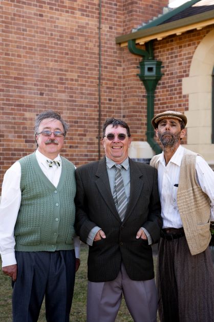 Des Gellert as Frank Pickle and Ian Whiteley as Jim Trott and Phillip Fresta as Owen Newitt outside the Bundaberg Anglican Church