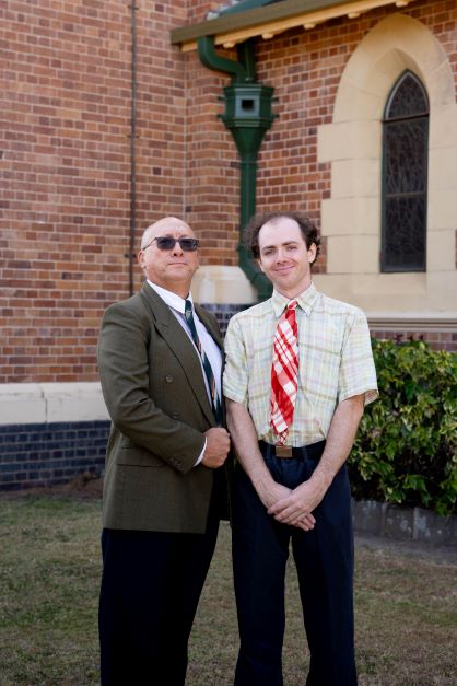 Nigel Dick as David Horton and Rowan Lawton as Hugo Horton outside the Bundaberg Anglican Church