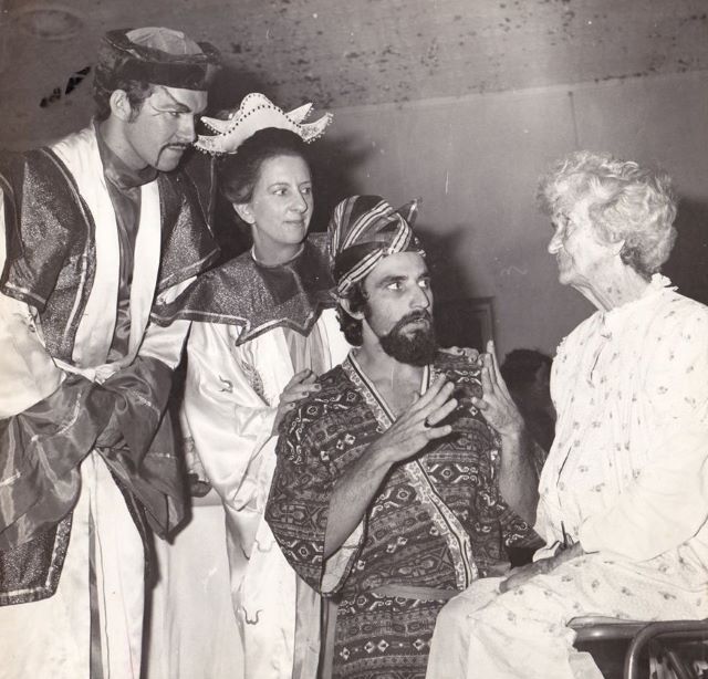 Aladdin cast John Stoutley Peg Danaher and Peter Rehbein visiting an elderly patient at the Base Hospital